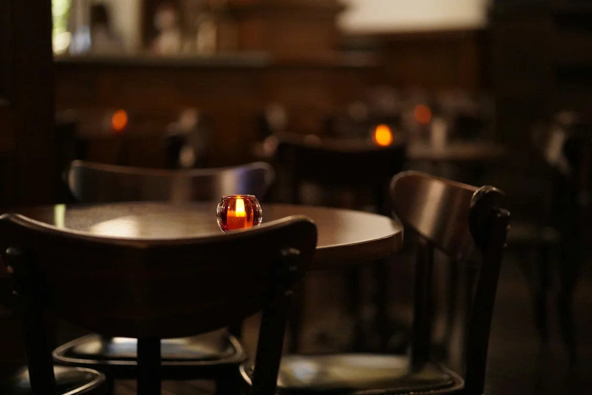 Candlelit restaurant interior with warm evening lighting